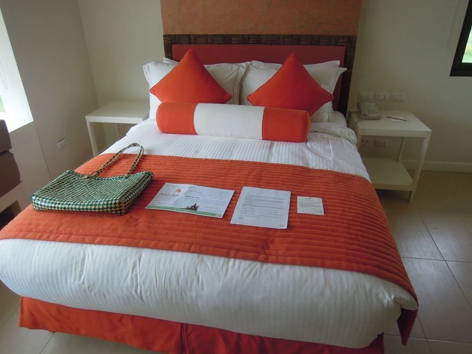 King size bed of a deluxe garden view room in Misibis Bay