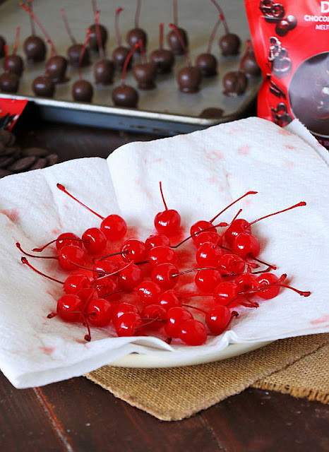 Maraschino Cherries with Stems Draining on Paper Towels Image