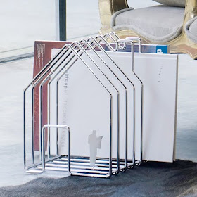 white magazine rack shaped like a house