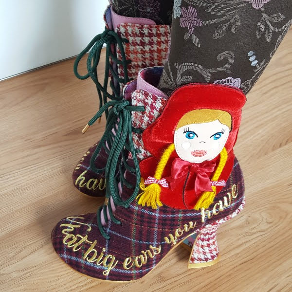 wearing tartan ankle boots with Little Red Riding Hood applique girl on side