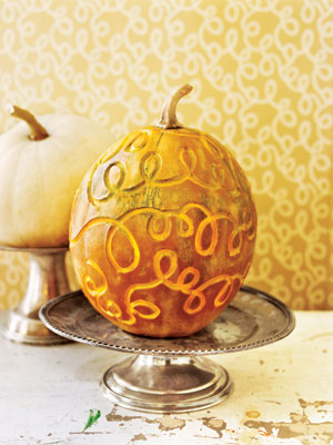 Disguise your pumpkin with a vintage as shown or new Halloween mask