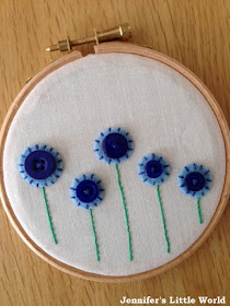 Embroidery hoop art with felt and button flowers