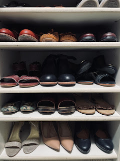 A closet up of shoes in a closet