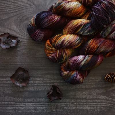 dark variegated yarn on background of wood