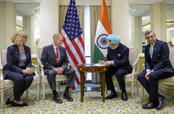 On June 21, 2023, Indian Ambassador Taranjit Sandhu signs the Artemis Accords as the U.S. Department of State's Nancy Jackson and NASA Administrator Bill Nelson look on...with the Indian Space Research Organization's Krunal Joshi also in attendance at the Washington, DC-based ceremony.