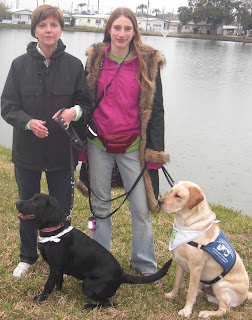 Toby and I with Ellen and Bingo.  Ellen is a PR in our group, Bingo's a female black lab.  The lake is the background