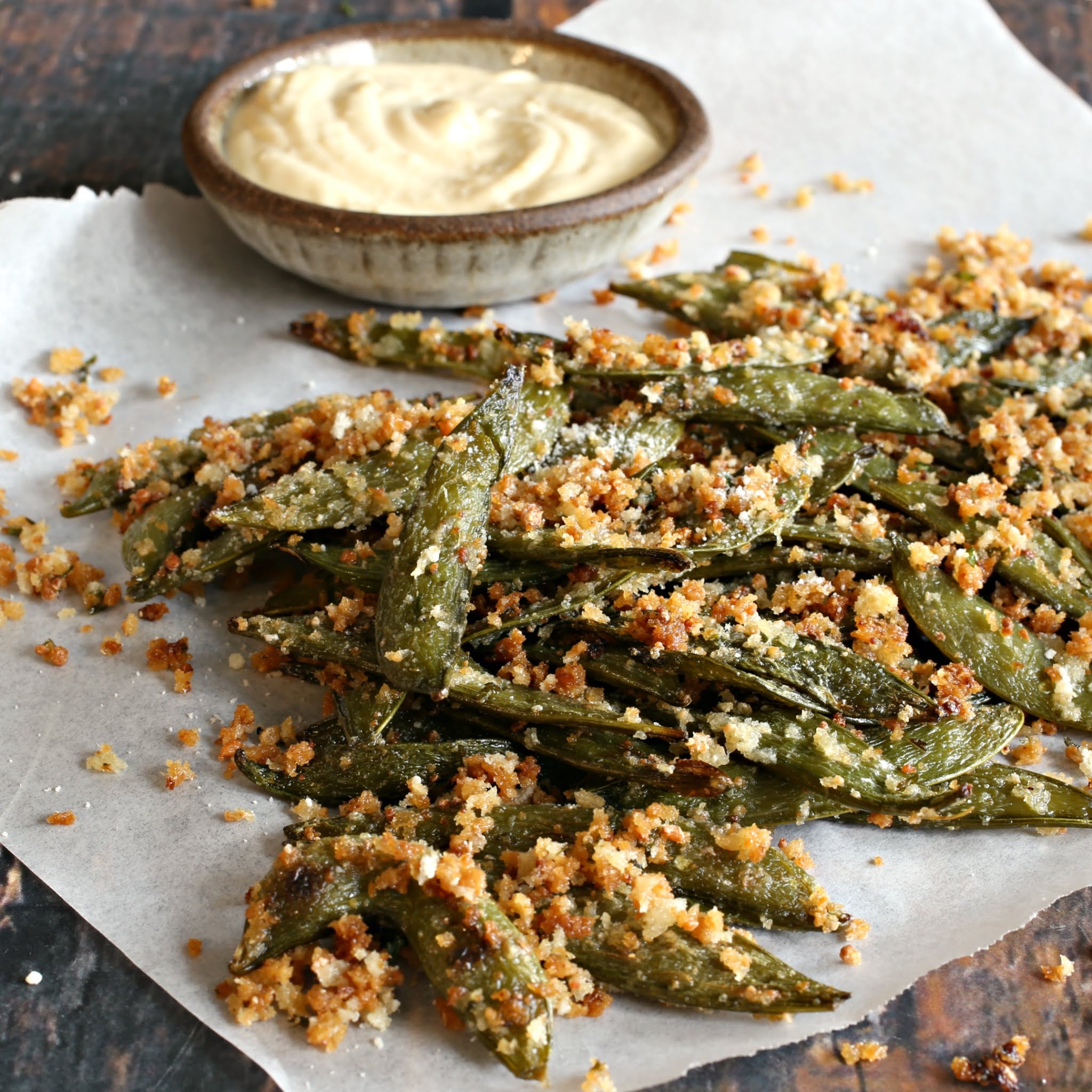 Crispy, oven roasted sugar snap peas with olive oil, cheese and seasoning.