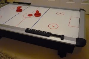 Miniature air hockey table