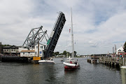 The Mystic River is crossed by a creaky old drawbridge that opens at 40 . (mystic drawbridge)