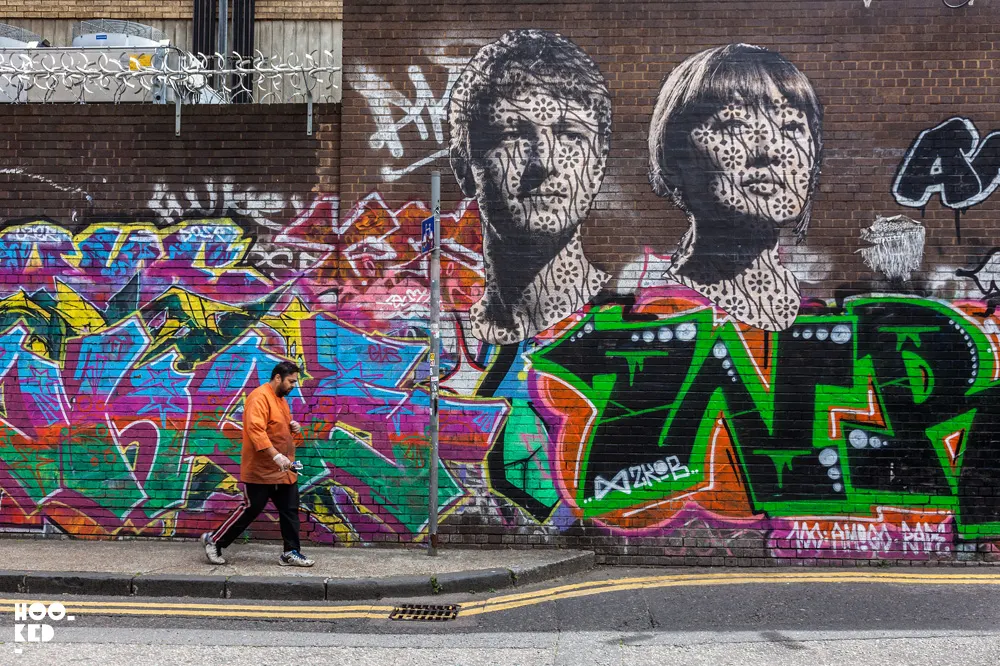 Street Artist Donk's large portraits on Grey Eagle Street, London.