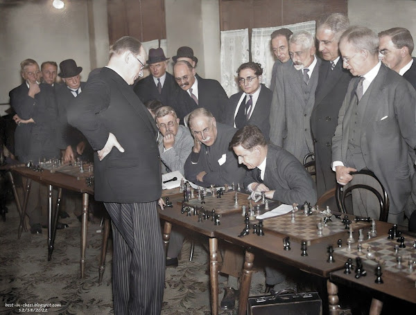 Dr. Alekhine world's chess champion plays competitors simultaneously in London.