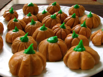 Being made from butter and peanut butter with food coloring, you can make these  Peanut Butter Pumpkins for kids on Halloween.