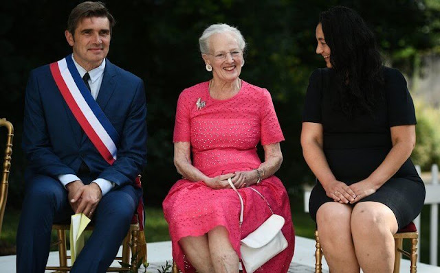Queen Margrethe II of Denmark wore a pink lace midi dress, flower earrings at Henri-Martin Museum in Cahors