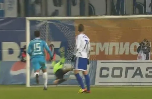 Dynamo goalkeeper Roman Berezovsky fails to stop a goal of Zenit player Szabolcs Huszti