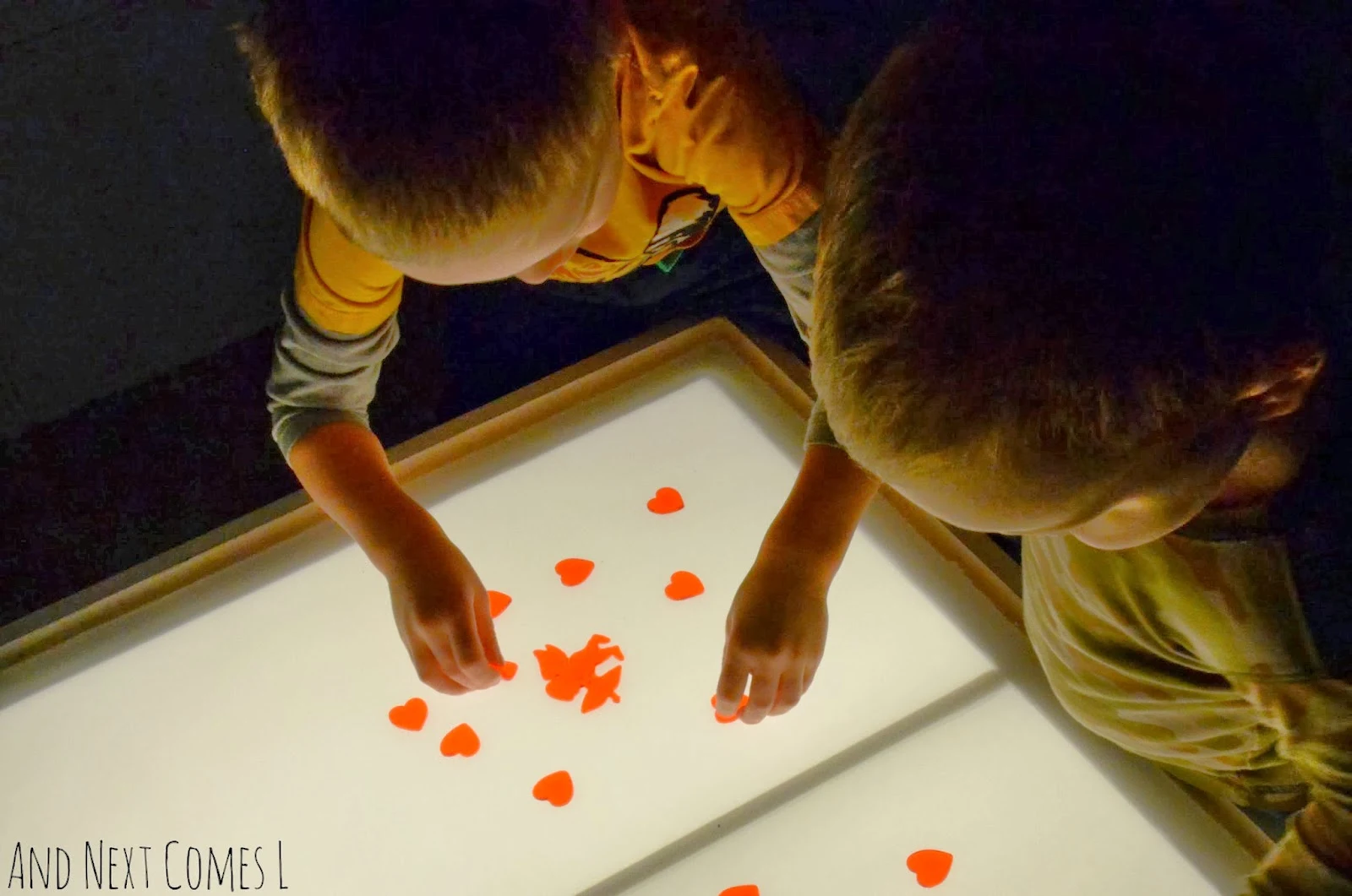 Sticky hearts on the light table from And Next Comes L