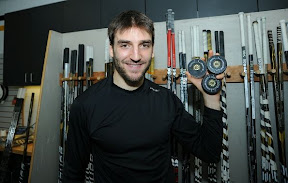 Patrice Bergeron celebrates his first career NHL hat trick after the game