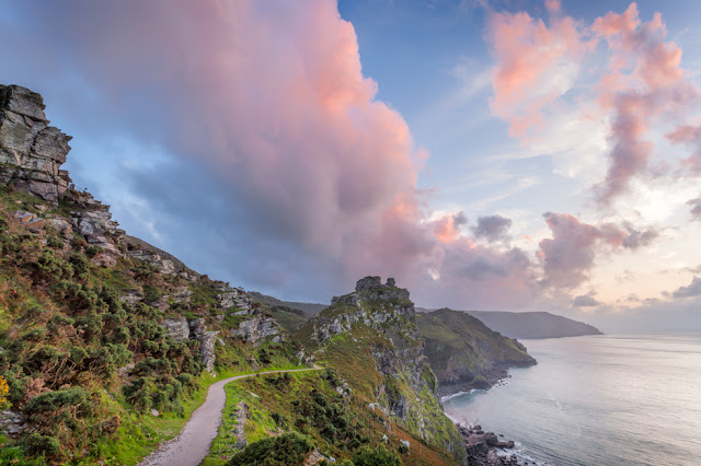 Coast path at Valley of Rocks under colourful sunset clouds in Exmoor