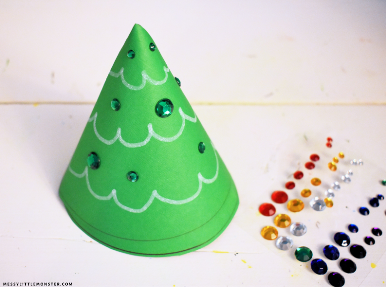 Decorating a paper cone Christmas tree