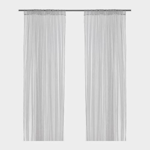 Whimsical Canopy Tent or Reading Nook made from curved curtain rod and $4 ikea curtains