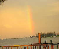 a rainbow at sunset on nassau harbour