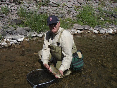 John Corrigan with a Montana trout. Photo courtesy of J. Corrigan