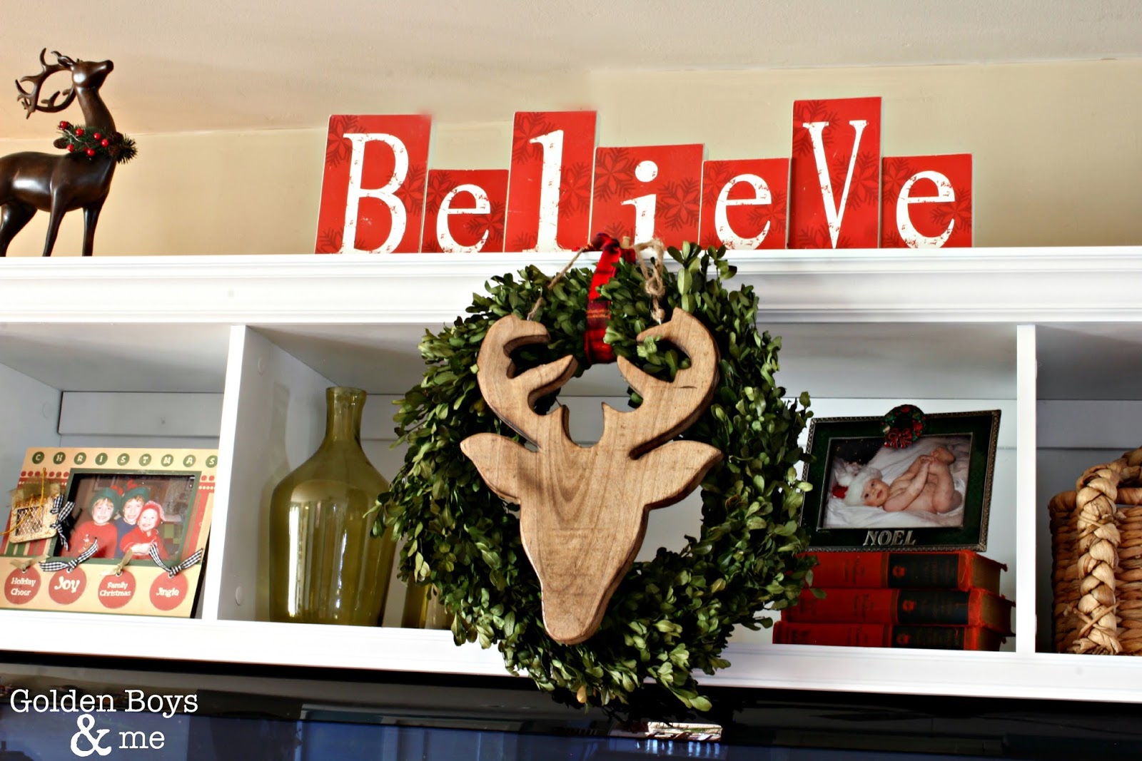 Rustic wooden deer head on boxwood wreath in Christmas family room-www.goldenboysandme.com