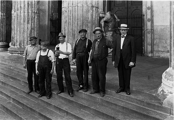 Men on west steps with cat / The Field Museum Library