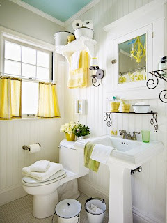 <img alt="a bathroom with yellow and white."