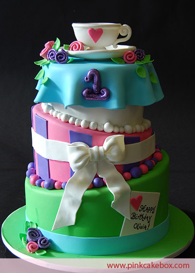 Lovely Mad Hatter Cake four tier wedding cake in blue purple green pink 