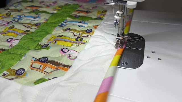 Machine sewing scrappy quilt binding