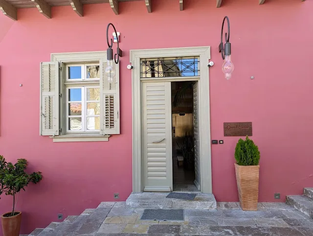 Pink facade of Hotel Grand Sarai in Nafplio Greece