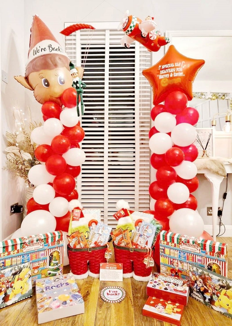 epic elf arrival with balloons and gifts