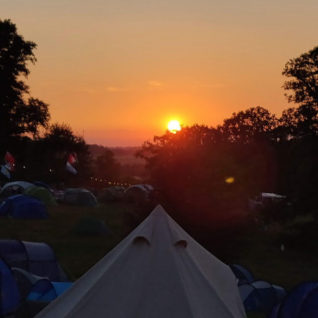 sunset at campsite at Cornbury Festival, Great Tew park