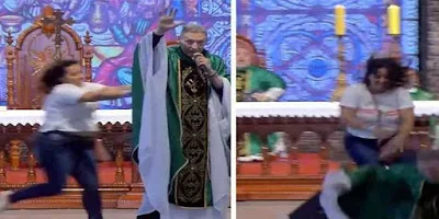 imagem de uma mulher empurrando Padre Marcelo Rossi do altar