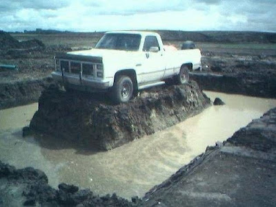 Truck surrounded by a moat