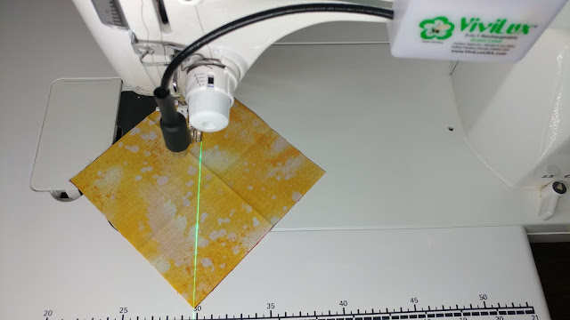 Using a sewing machine laser