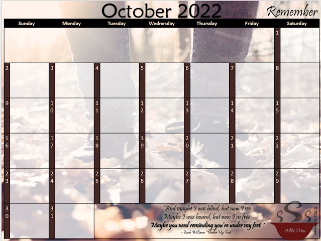 A foot steps on autumn leaves in the background, foreground features an October 2022 calendar featuring a black and brown color scheme