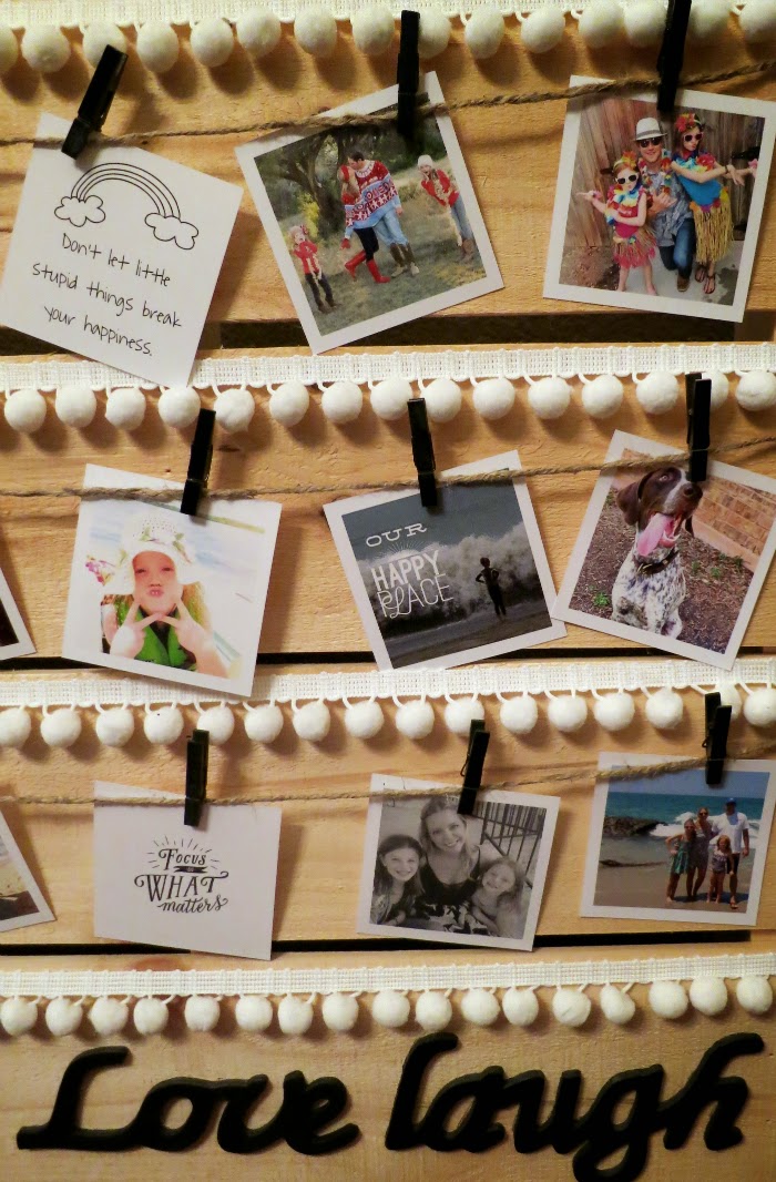 clothes pins and pom poms for displaying pictures