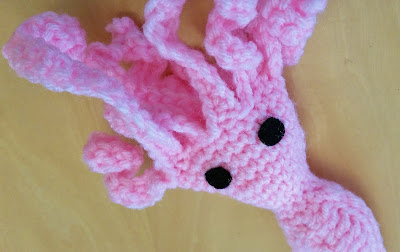 Crochet squid cat toy with refillable catnip pocket