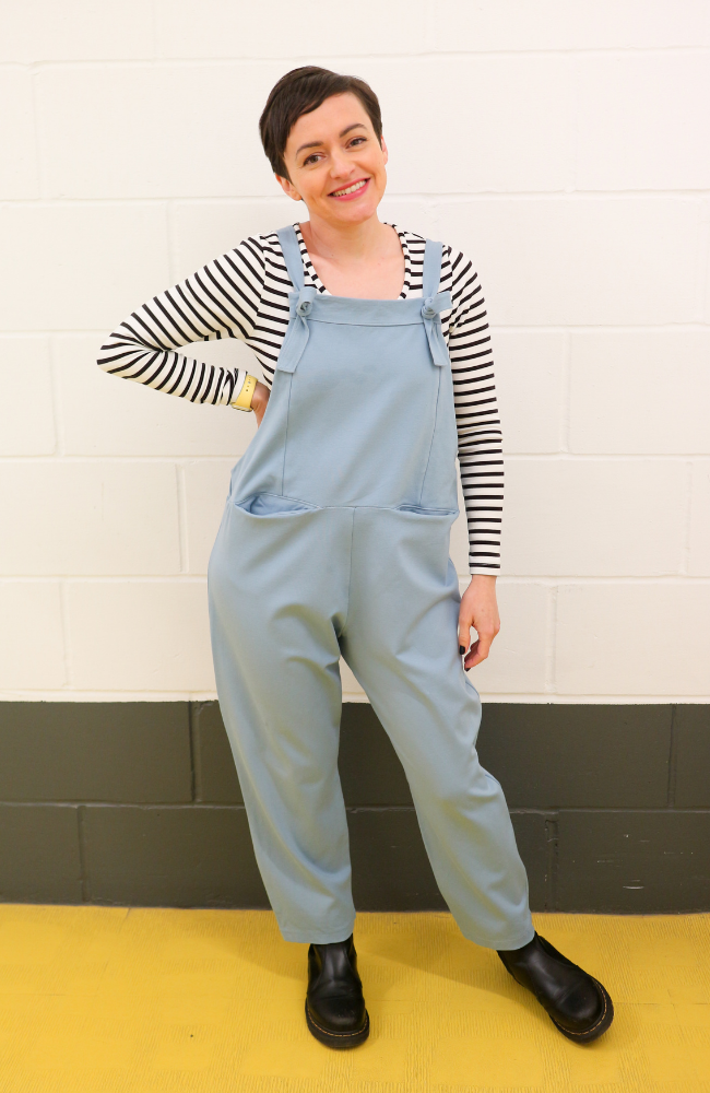 Tilly wears a pair of Erin dungarees in light blue ponte roma