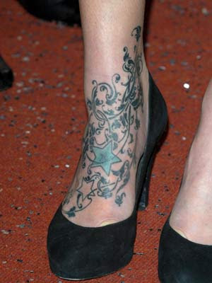 right foot of fearne cotton with a tree tattoo designs and shooting star