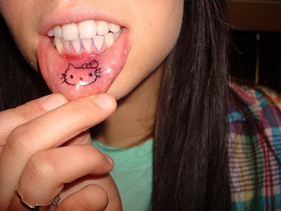 this lips tattoo with heloo kitty tattoo designs