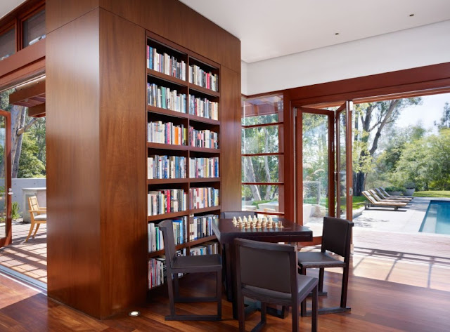 Chess table by the book shelf 