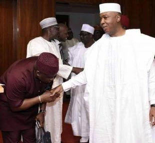 See the difference: Senator Bassey Albert greeting Pres. Buhari vs Bukola Saraki 2