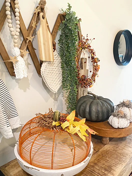 pumpkin basket on shelf with pegs