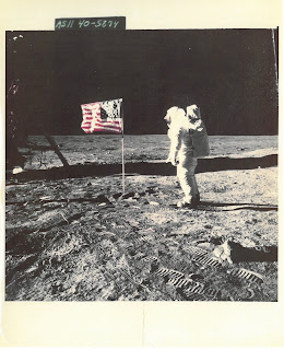 Photo of astronaut on Moon with flag