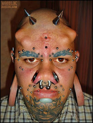 Common forms of "acceptable" body modification include ear piercing, 