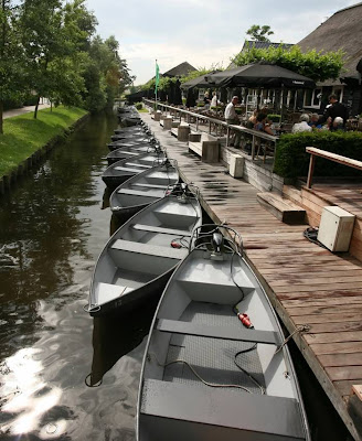 Can you imagine a village with no roads? There is such a place in the Netherlands called Giethoorn (pronounced 'geethorn'). There are no roads and cars have to remain outside the village. The only access to the stunningly lovely houses in Giethoorn is by water, or on foot over tiny individual wooden bridges.