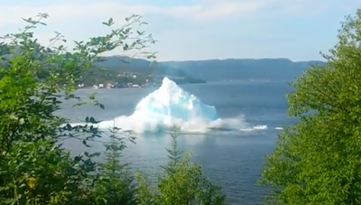 Iceberg collapsing and making a strong tidal waves