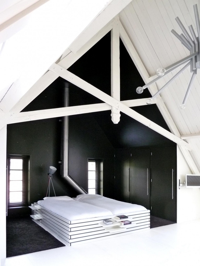 Picture of black colored walls around the bed